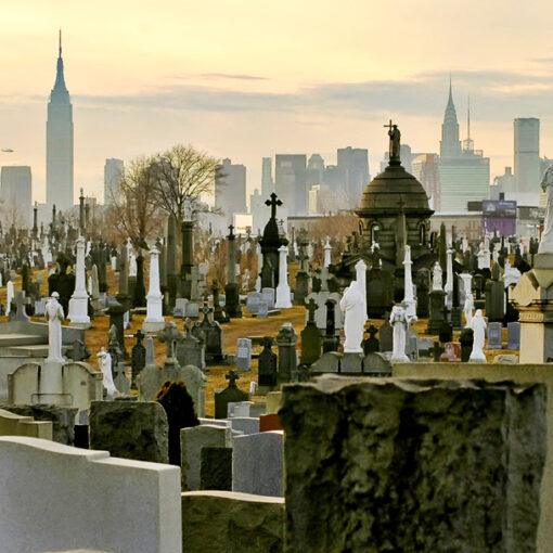 Headstones in Calvary Cemetery with NYC Skyline in Background